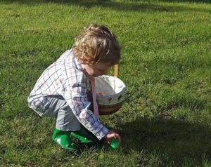 Easter Egg hunt - child finding easter egg